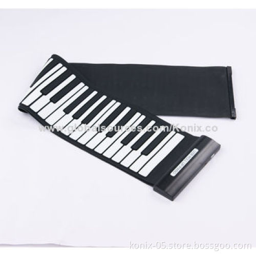 Some one play a folding roll up piano for learning